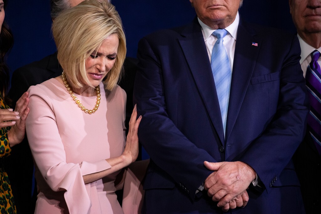 Pastor Paula White prays over President Donald Trump during an "Evangelicals for Trump Coalition Launch" at King Jesus International Ministry, Friday, Jan. 3, 2020, in Miami. (AP Photo/ Evan Vucci)
