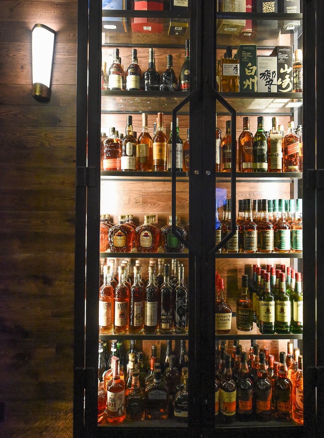 (Francisco Kjolseth  |  The Salt Lake Tribune)  A glass tower cabinet of fine spirits at the new London Belle Supper Club, a new Salt Lake City bar named after Belle London, a famous Utah madam, at 321 S. Main.