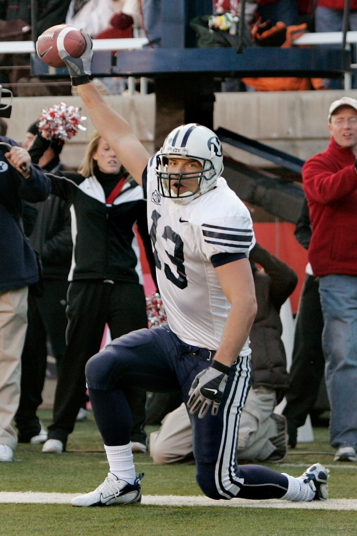 Brigham Young tight end Jonny Harline (13) celebrates one of his touchdown catches against Utah during the fourth quarter of their college football game Saturday, Nov. 25, 2006, in Salt Lake City. Harline had 118 receiving yards and 3 touchdowns for the day. BYU beat Utah, 33-31. (AP Photo/Douglas C. Pizac)