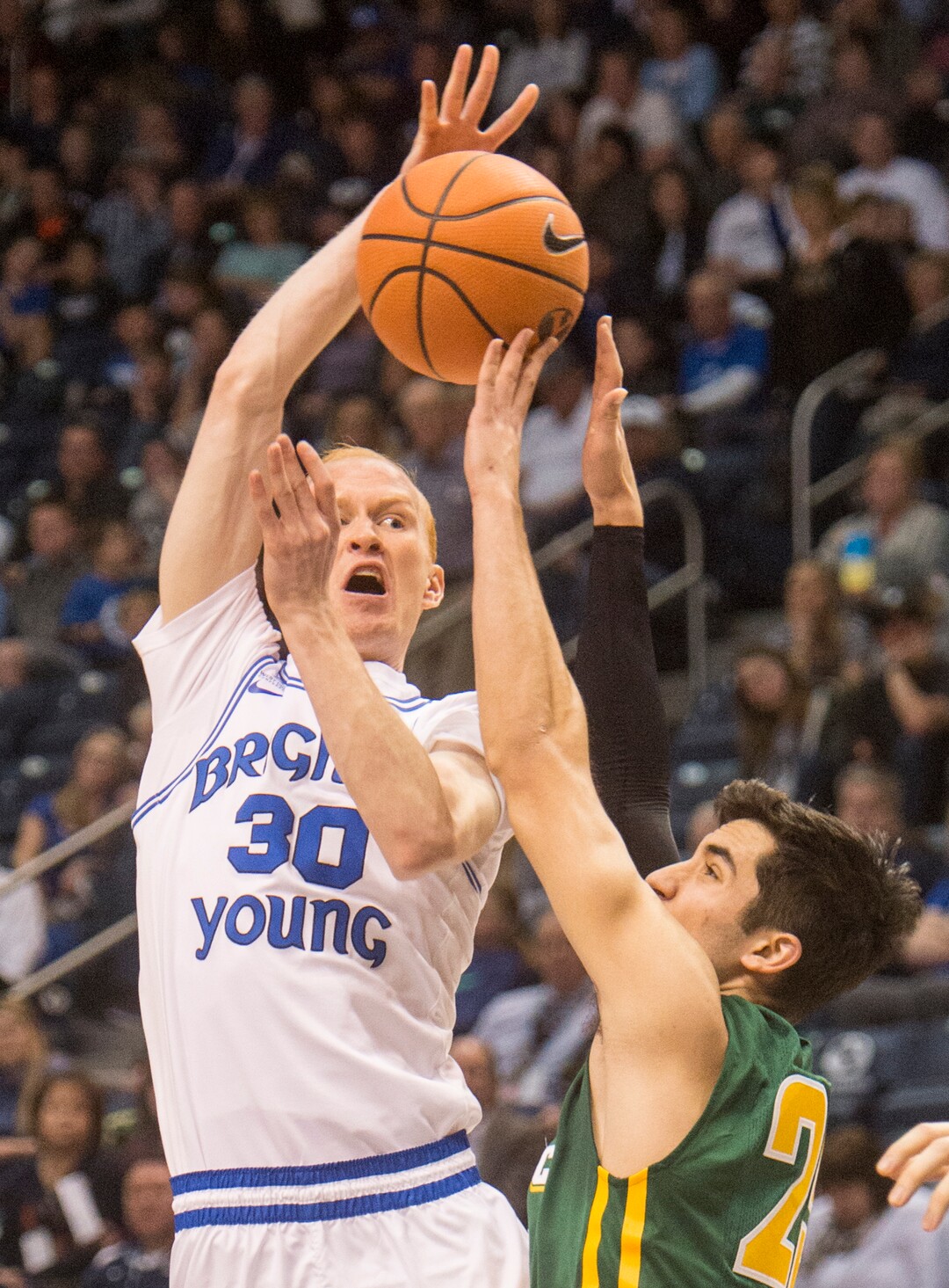 (Rick Egan  |  The Salt Lake Tribune)  Brigham Young Cougars guard TJ Haws (30) tries to get the ball past San Francisco Dons guard Jordan Ratinho (25), in basketball action at the Marriott Center, Saturday, February 10, 2018.