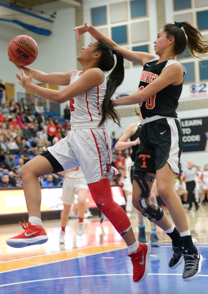 (Leah Hogsten  |  The Salt Lake Tribune)  Timpview's Jazzy Espinoza (10) fouls East's Margarita Satini (02) on her way to the net. East faces Timpview in the championship game of the 5A High School Girls' Basketball Tournament at SLCC in Taylorsville, Saturday, Feb. 24, 2018.