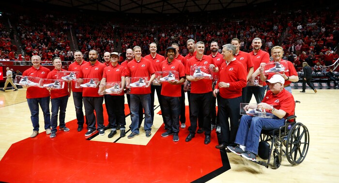 Players from the Utah team which played in the 1998 NCAA championship game against Kentucky are honored during a halftime ceremony in Utah's NCAA college basketball game against California on Saturday, Feb. 10, 2018, in Salt Lake City. (AP Photo/Rick Bowmer)