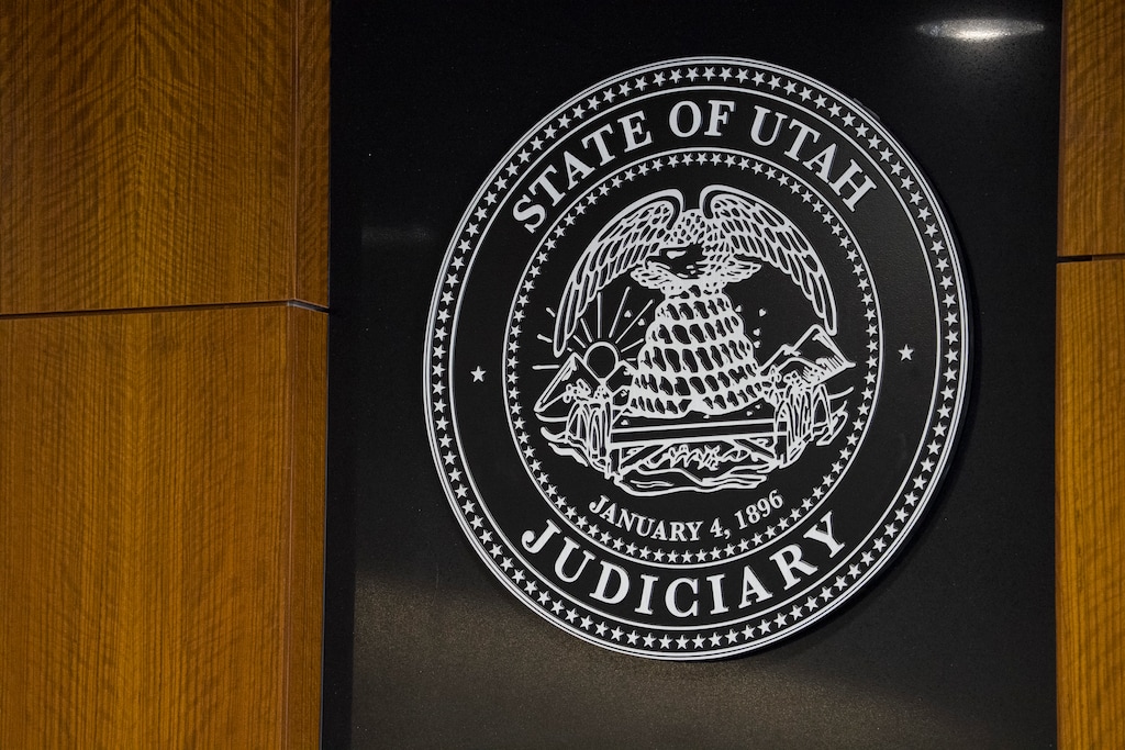 (Bethany Baker  |  The Salt Lake Tribune) The logo for the state of Utah judiciary is seen during the sentencing for Jesse Taggart, a man found guilty of attempted aggravated murder, aggravated assault, discharge of a firearm and riot during a Black Lives Matter protest in 2020, in the courtroom in Provo on Monday, April 6, 2026.