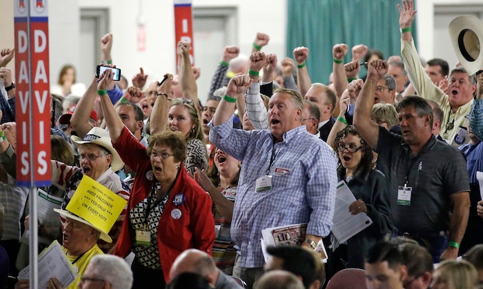 FILE - In this April 23, 2016, file photo, delegates cheer during the Utah Republican Party 2016 nominating convention in Salt Lake City. Utah's Republican Party is pressing on with a legal battle that's divided the state GOP and will argue before a Denver-based appeals court Monday, Sept. 25, 2017, that a state candidate nominating law violates its rights. (AP Photo/Rick Bowmer, File)
