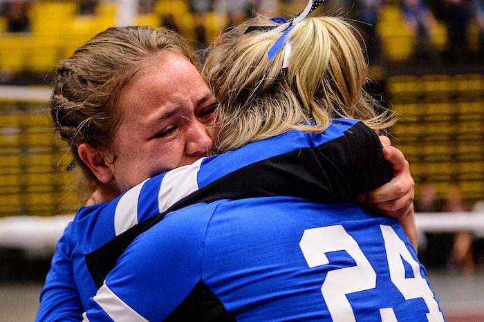 (Trent Nelson | The Salt Lake Tribune) Panguitch's Mataya Barney and Abbey Blevins embrace as Panguitch defeats Rich in the 1A State Volleyball Championship game in Orem, Saturday October 28, 2017.