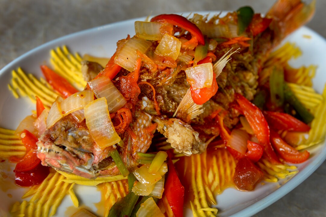 (Leah Hogsten  |  The Salt Lake Tribune)  Saola new menu item; sweet chili red snapper, deep fried and served with sweet chili sauce, mango and rice. Saola restaurant, located in Cottonwood Heights, serves Vietnamese food using locally sourced ingredients.
