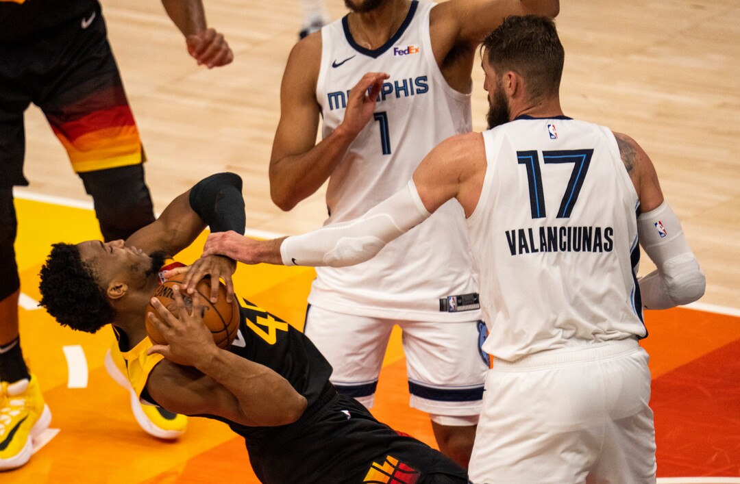 (Rick Egan | The Salt Lake Tribune) Utah Jazz guard Donovan Mitchell (45) hits the ground as he grabs a rebound, in game 2 of NBA Playoffs between the Utah Jazz and the Memphis Grizzlies, at Vivint Arena, on Wednesday, May 26, 2021.