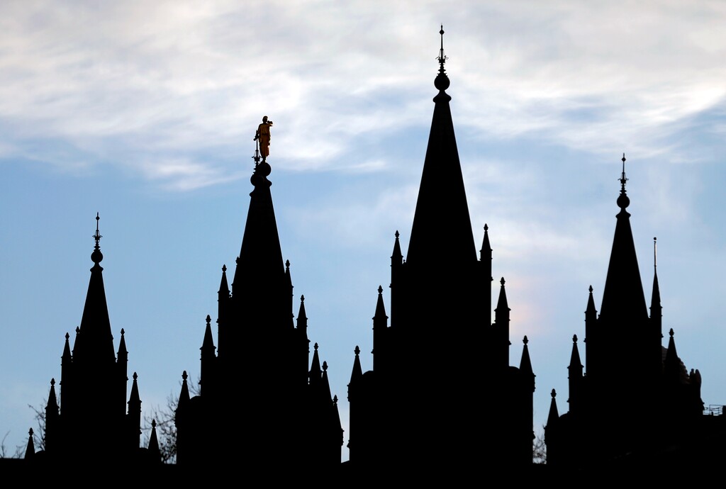 The angel Moroni statue, silhouetted against the sky, sits atop the Salt Lake Temple, at Temple Square, Wednesday, Jan. 3, 2018, in Salt Lake City. (AP Photo/Rick Bowmer)