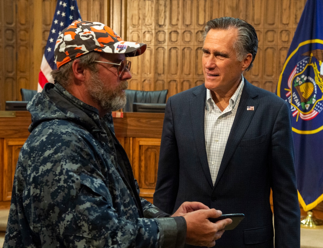 (Rick Egan  |  The Salt Lake Tribune)       Robert Korchnak visits with Mitt Romney after the town hall meeting in the Provo City Hall Council Chambers, Friday, June 21, 2019.