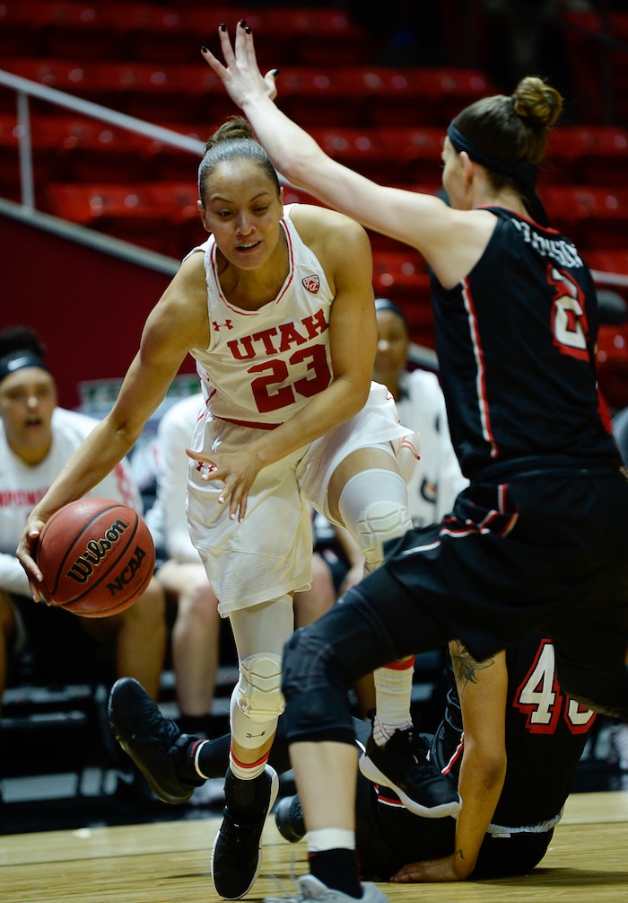 (Francisco Kjolseth  |  The Salt Lake Tribune)  Utah Utes guard/forward Daneesha Provo (23) tries to push past UNLV Rebels guard Brooke Johnson (2) as Utah hosts UNLV in women's NCAA basketball at the Huntsman Center, Thursday, March 15, 2018.