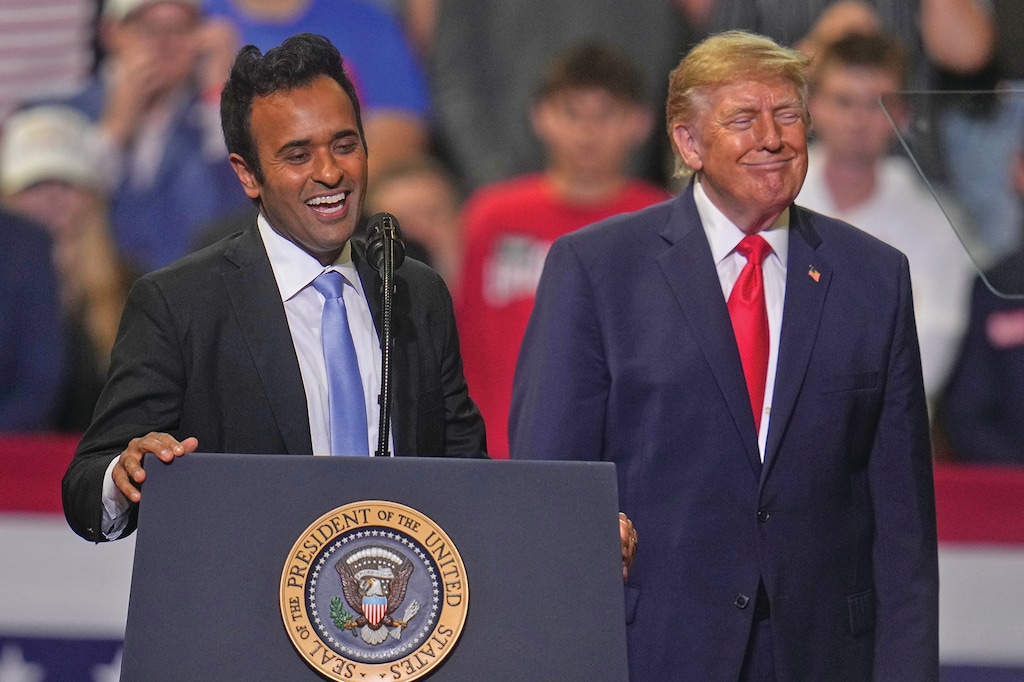 President Donald Trump listens as gubernatorial candidate Vivek Ramaswamy speaks at a campaign rally at the Covelli Centre, in Youngstown, Ohio, Monday, Oct. 12, 2026. (AP Photo/Gene J. Puskar)