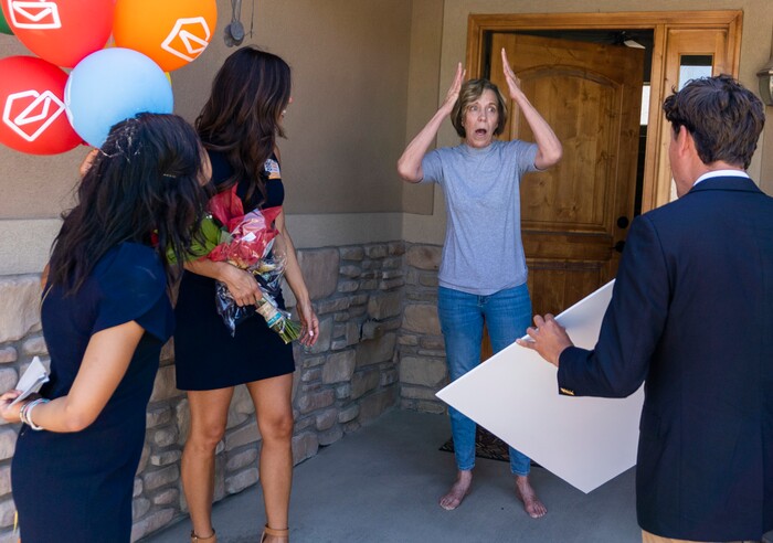 (Rick Egan | The Salt Lake Tribune) Members of the Prize Patrol from Publishers Clearing House, from left,  Bianca Quinnonez, Danielle Lam and  Howie Guja surprise Denise Hagman (center) with the news that she and her husband won $1,000,000, at her home in Herriman, on Friday, May 28th