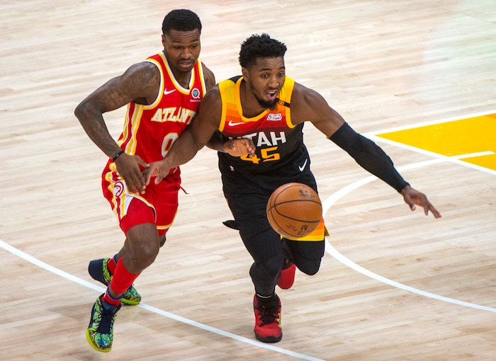 (Rick Egan | The Salt Lake Tribune) Utah Jazz guard Donovan Mitchell (45) knocks the ball out of the hands of Atlanta Hawks guard Brandon Goodwin (0), in NBA action between the Utah Jazz and the Atlanta Hawks at Vivint Arena, on Friday, Jan. 15, 2021.
