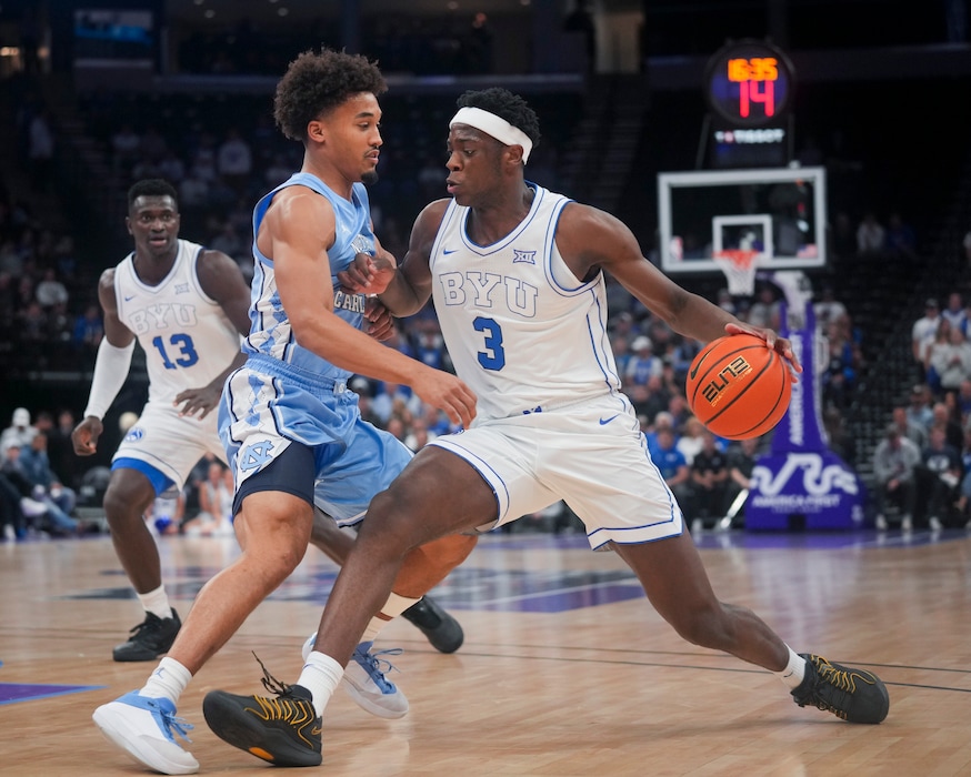 (Bethany Baker | The Salt Lake Tribune) BYU Cougars forward AJ Dybantsa (3) drives to the basket as North Carolina Tar Heels guard Seth Trimble (7) defends during the game between the BYU Cougars and the North Carolina Tar Heels at Delta Center on Friday, Oct. 24, 2025.