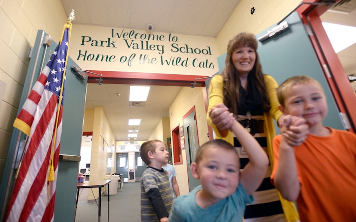 (Al Hartmann | The Salt Lake Tribune) Park Valley School head teacher Melissa Morris leads her kindergarten through second graders on an exploration of the school Wednesday August 30.