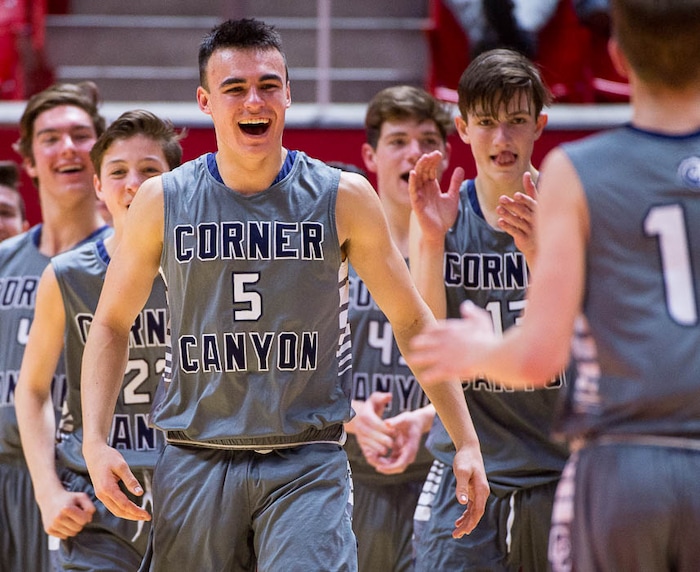 (Trent Nelson | The Salt Lake Tribune)  Box Elder vs. Corner Canyon, 5A State high school basketball tournament at the Huntsman Center in Salt Lake City, Wednesday Feb. 28, 2018. Corner Canyon's Luke Warnock (5) and teammates celebrate a double-digit lead in the fourth quarter.