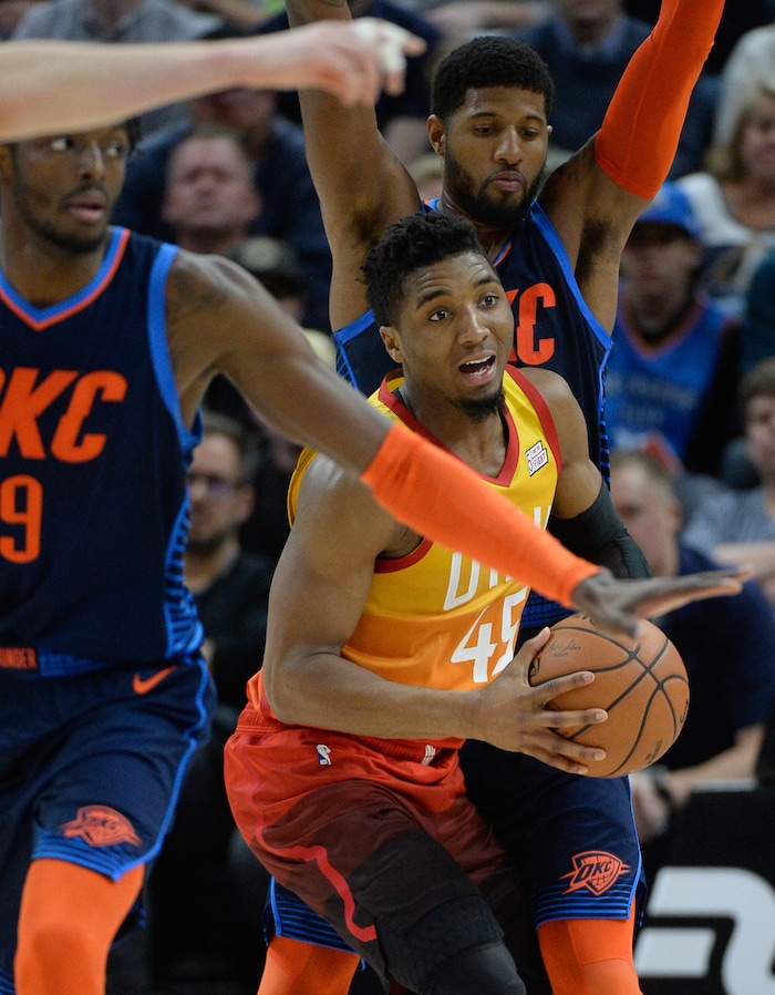 (Francisco Kjolseth  |  The Salt Lake Tribune)   Utah Jazz guard Donovan Mitchell (45) finds himself surrounded by the Thunder defense in the second half of the NBA game at Vivint Smart Home Arena Sat., Dec. 22, 2018, in Salt Lake City.