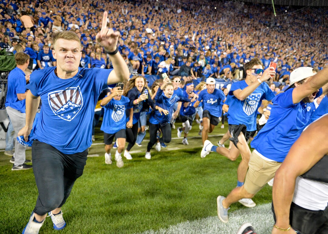 (Chris Samuels | The Salt Lake Tribune) Fans storm the field as the Brigham Young Cougars defeat the Utah Utes 26-17 in football, Saturday, Sept. 11, 2021 in Provo.