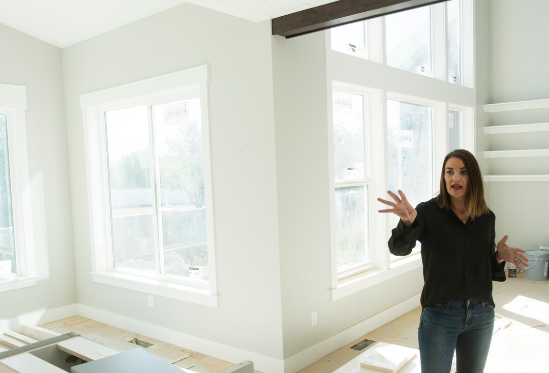 (Rick Egan  |  The Salt Lake Tribune)    Myra Petersen, points out some of the features in a custom home in Riverton, Monday, Sept. 24, 2018.