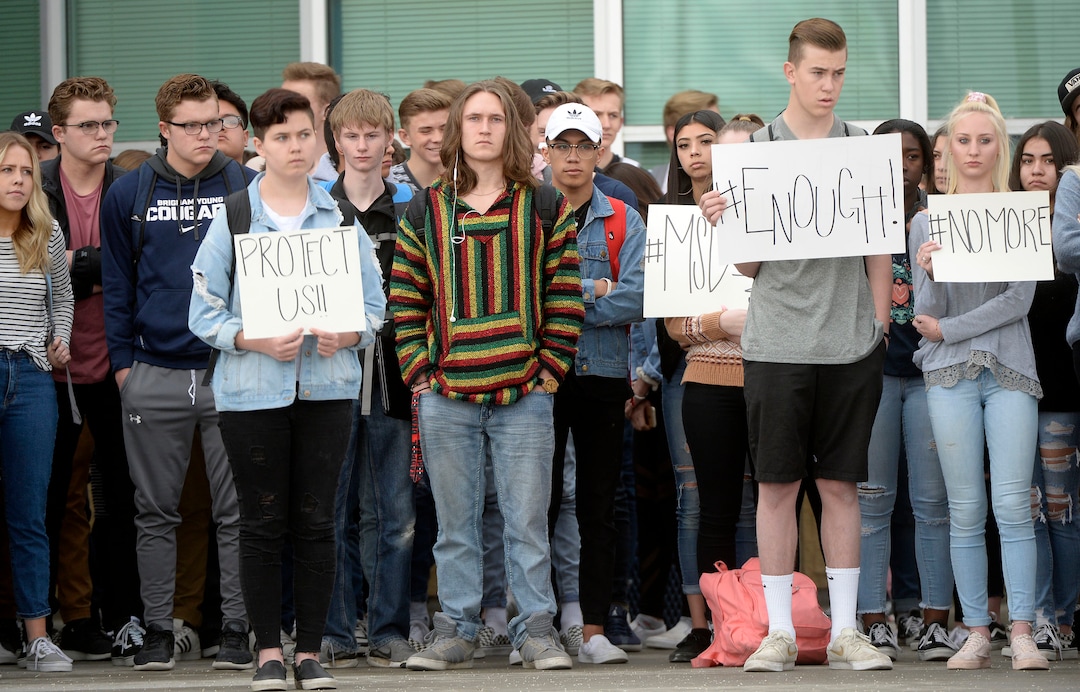 (Al Hartmann  |  The Salt Lake Tribune) 	About 80 students at Westlake High School in Saratoga Springs left class and stood together in silence at the front entrance of the school Wednesday March 14, 2018 to remember the 17 students who died in a school shooting in Florida.  They held posters of the names of those killed. 