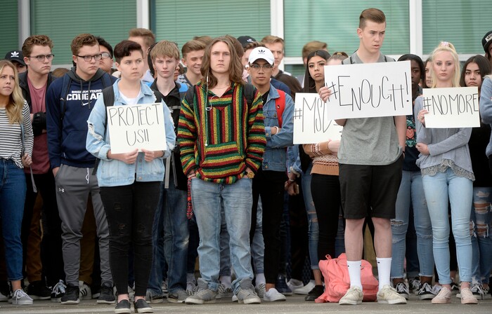 (Al Hartmann  |  The Salt Lake Tribune) 	
About 80 students at Westlake High School in Saratoga Springs left class and stood together in silence at the front entrance of the school Wednesday March 14, 2018 to remember the 17 students who died in a school shooting in Florida.  They held posters of the names of those killed. 