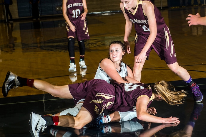 Chris Detrick  |  The Salt Lake TribuneSalem Hills' Lauren Gustin (12) and Maple Mountain's Elli Eastmond (15) fight for a rebound during the game at Salem Hills High School Tuesday January 12, 2016. Salem Hills won the game 82-63.