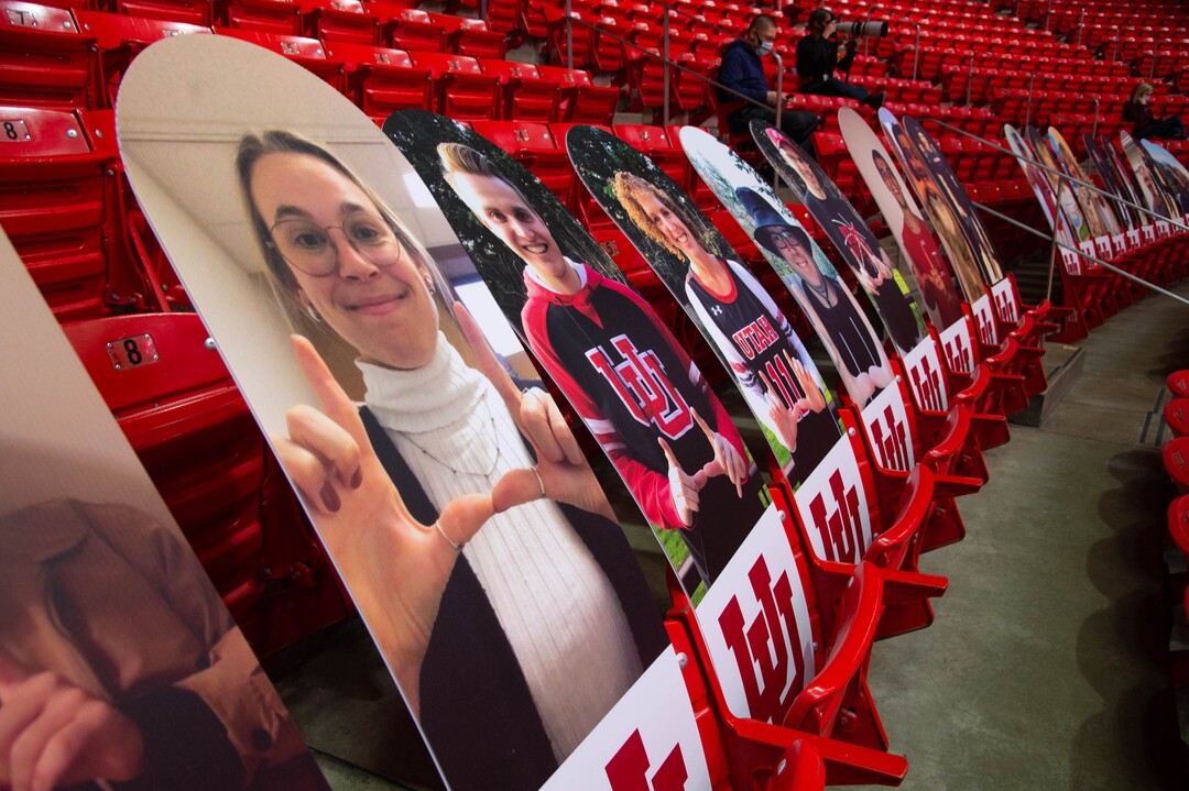 (Francisco Kjolseth  | The Salt Lake Tribune) Photographs and piped in sounds of a crowd fill the void as the Utes host the Stanford Cardinals on Thursday, Jan. 14, 2021 at the Jon M. Huntsman Center in Salt Lake City.