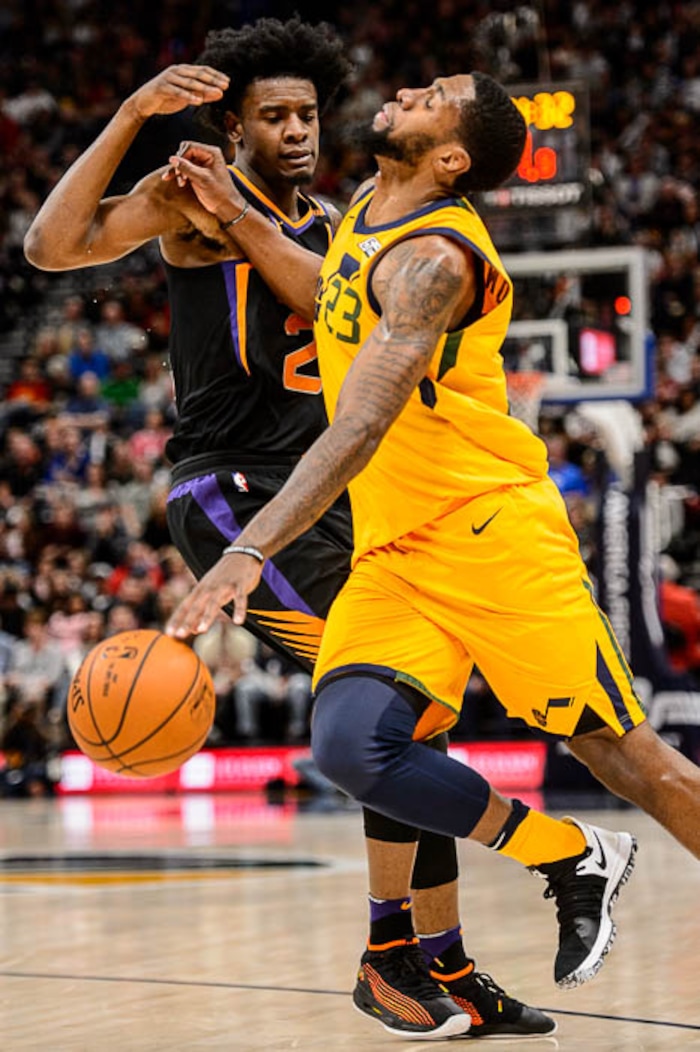 (Trent Nelson | The Salt Lake Tribune)  Utah Jazz forward Royce O'Neale (23) collides with Phoenix Suns forward Josh Jackson (20) as the Utah Jazz host the Phoenix Suns, NBA basketball in Salt Lake City, Wednesday Feb. 14, 2018.