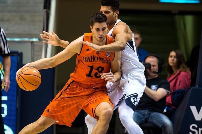 (Chris Detrick  |  The Salt Lake Tribune)  Brigham Young Cougars forward Yoeli Childs (23) guards Idaho State Bengals center Novak Topalovic (13) during the game at the Marriott Center Thursday, December 21, 2017.  