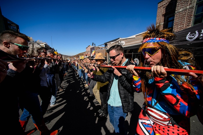 (Trent Nelson | The Salt Lake Tribune)
Participants line Park City’s Historic Main Street to throw one back at the annual Shot Ski event on Saturday Oct. 12, 2019.