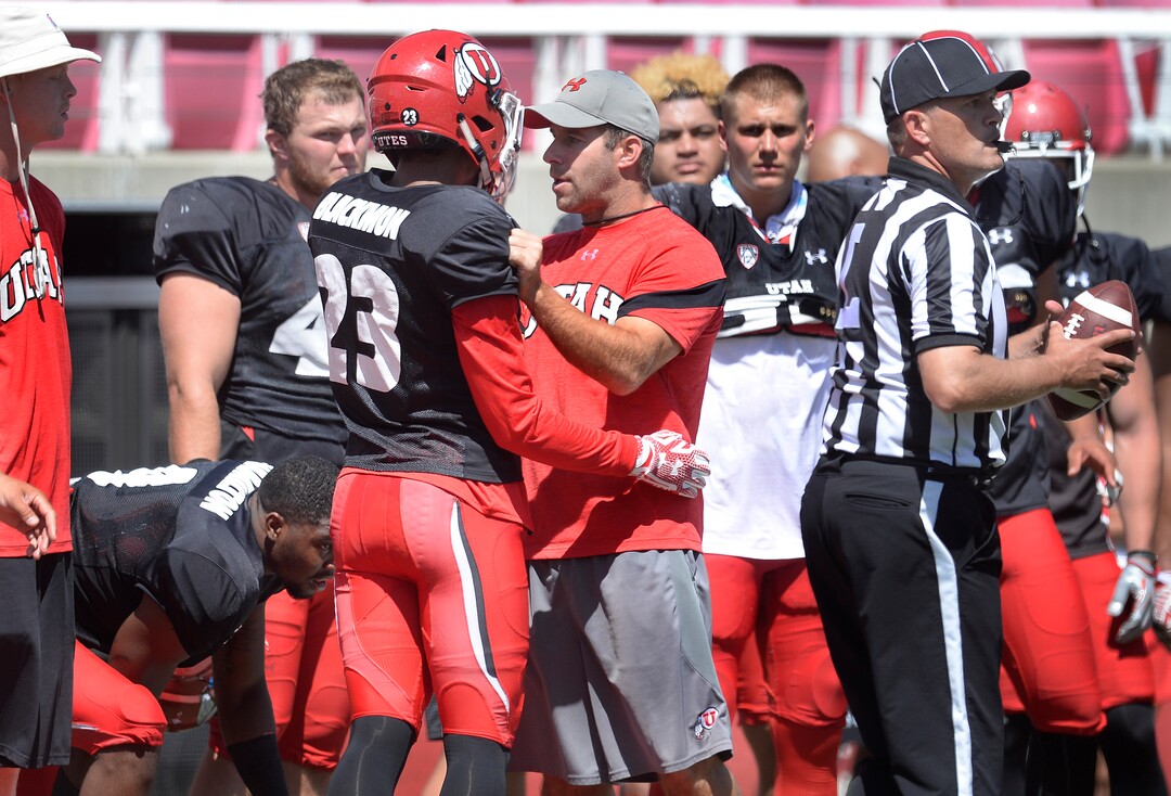 Scott Sommerdorf   |  The Salt Lake Tribune  Utah Defensive Coordinator / Safeties, Morgan Scalley, pulls aside DB Julian Blackmon to congratulate him on his play during practice, Thursday, August 11, 2016. 