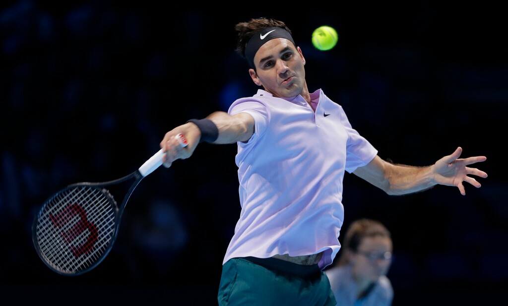 Roger Federer of Switzerland plays a return to Marin Cilic of Croatia during their mens singles match at the ATP World Finals at the O2 Arena in London, Thursday, Nov. 16, 2017. (AP Photo/Alastair Grant)