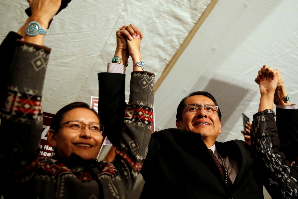 (Noel Smith | The Daily Times | The Associated Press) In this Nov. 6, 2018, file photo, Jonathan Nez, right, stands with his wife, Phefelia Herbert-Nez, at the election night party for his presidential campaign in Window Rock, Ariz.
