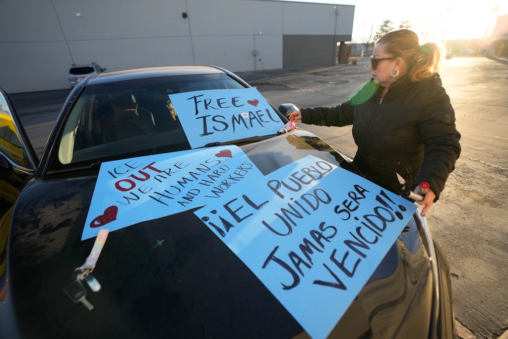 (Francisco Kjolseth | The Salt Lake Tribune) Isela Cassidy makes posters as community members and activists begin to gather at an auto shop in West Valley City on Monday, February. 2, 2026, after immigration agents arrested her brother and an employee there last week. The agents said they didn't need a warrant to break into the shop after a man went into it, according to video taken by Lily Gonzalez.