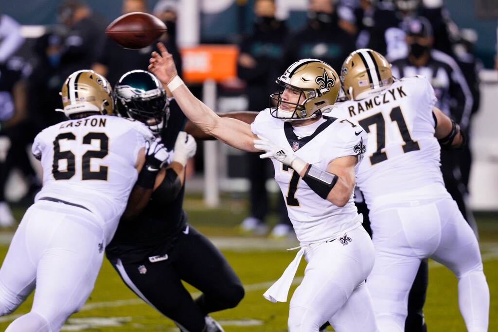 New Orleans Saints' Taysom Hill passes during the first half of an NFL football game against the Philadelphia Eagles, Sunday, Dec. 13, 2020, in Philadelphia. (AP Photo/Chris Szagola)