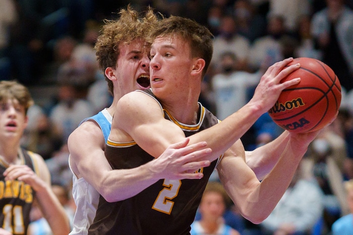 (Trent Nelson  |  The Salt Lake Tribune) Westlake's Kaden Hoppins defending Davis's Chance Trujillo as Davis defeats Westlake High School in the 6A boys basketball state championship game, in Taylorsville on Saturday, March 6, 2021.