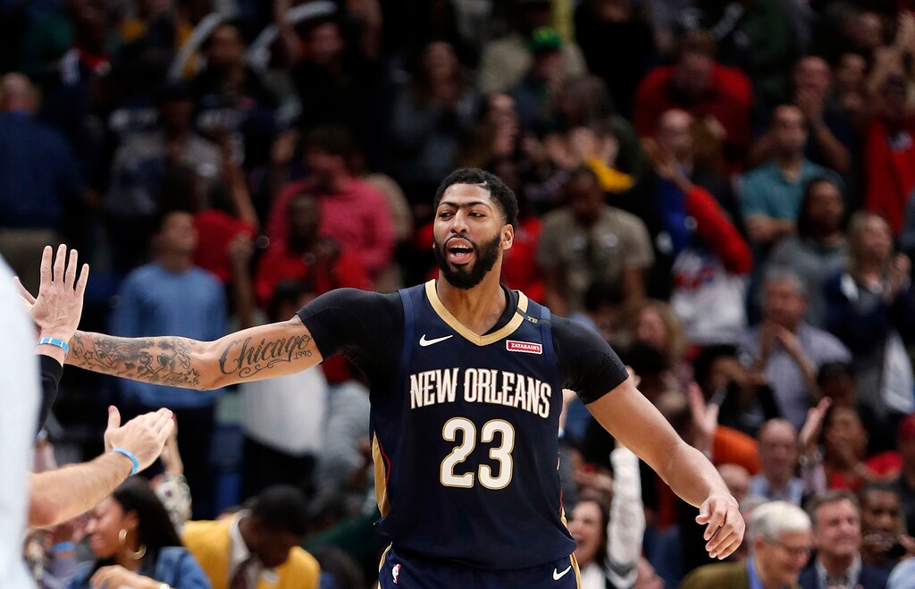 New Orleans Pelicans forward Anthony Davis (23) celebrates after they defeated the Brooklyn Nets by two points in an NBA basketball game in New Orleans, Friday, Oct. 26, 2018. The Pelicans won 117-115. (AP Photo/Gerald Herbert)