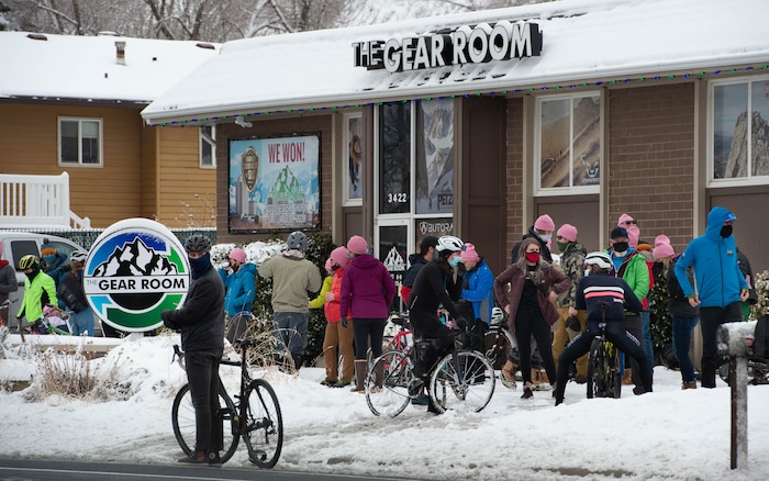 (Francisco Kjolseth  | The Salt Lake Tribune) People gather at The Gear Room along in Cottonwood Heights before setting out for a memorial bike ride along Wasatch Blvd in Salt Lake City on Sunday, Feb. 14, 2021, in honor of the four who died in an avalanche on Saturday, Feb. 6.