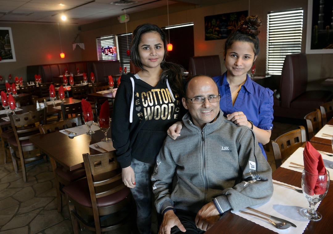 (Al Hartmann  |  The Salt Lake Tribune) 	
Kamal Niroula and his two daughters, Kiki Sharma, left, and Shrijana Sharma, in the recently opened Bhutan House in Sandy. Kamal and his wife, Geeta, moved to Utah with their three children in 2010. Originally from Bhutan, they lived in Nepal before their resettlement in the United States.  The couple participated in the Spice Kitchen Incubator program, initially catering and doing special events before opening their own restaurant, which serves foods from Bhutan, Nepal and India.