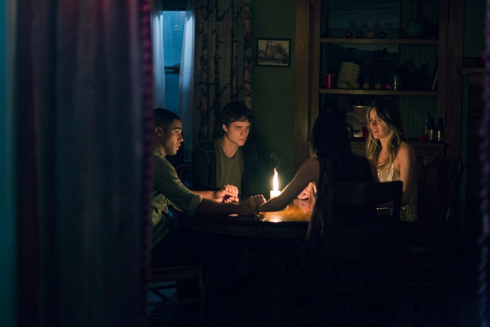 |  STX EntertainmentFour friends — from left: John (Lucien Laviscount), Elliot (Douglas Smith), Kim (Jenna Kanell) and Sasha (Cressida Bonas) — hold a seance and unleash a spooky presence in the horror thriller "The Bye Bye Man."