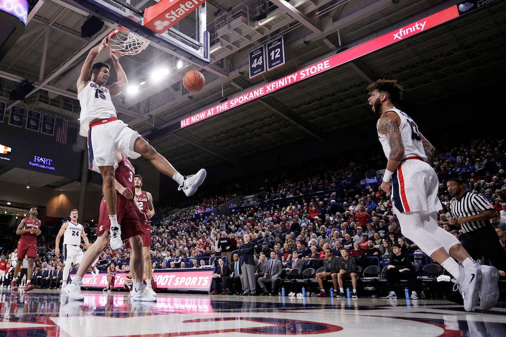 Gonzaga forward Brandon Clarke (15) dunks as guard Josh Perkins (13) reacts during the first half of an NCAA college basketball game against Santa Clara in Spokane, Wash., Saturday, Jan. 5, 2019. (AP Photo/Young Kwak)