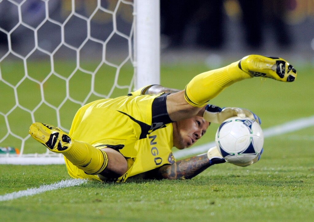 Real Salt Lake goalkeeper Nick Rimando blocks a shot against the Colorado Rapids during the second half of an MLS soccer game in Commerce City, Colo., Saturday, Aug., 4, 2012. Colorado defeated Real Salt Lake 1-0. (AP Photo/Jack Dempsey)