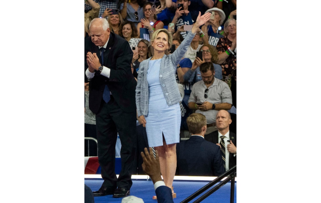 (Hiroko Masuike | The New York Times) Minnesota Gov. Tim Walz, the Democratic nominee for vice president, and his wife, Gwen Walz, appear at a campaign rally in Philadelphia on Aug. 6, 2024.