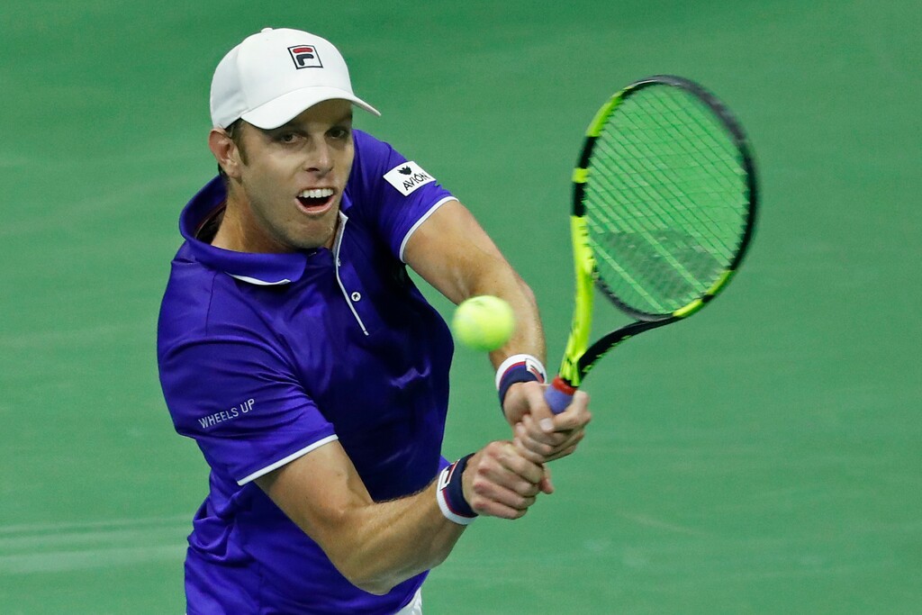 Sam Querrey, of the United States, returns a shot against Mischa Zverev, of Germany, during the fourth round of the U.S. Open tennis tournament, Sunday, Sept. 3, 2017. (AP Photo/Adam Hunger)