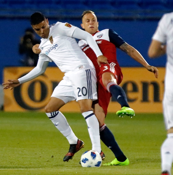 Real Salt Lake midfielder Luis Silva (20) gets in position against FC Dallas defender Reto Ziegler (3) during the first half of an MLS soccer game in Frisco, Texas, Saturday, March 3, 2018. (Stewart F. House/The Dallas Morning News via AP)