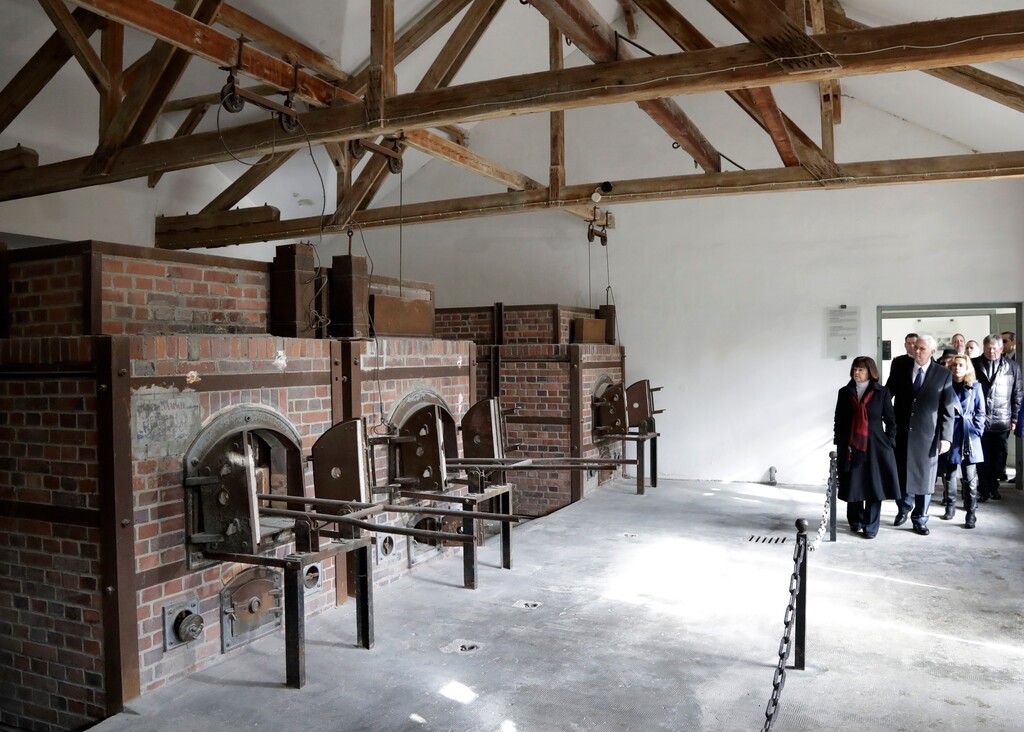 U.S. Vice President Mike Pence, second from right, his wife Karen and their daugher Charlotte, right, walk through the former crematories during a visit to the former Nazi concentration camp in Dachau near Munich, southern Germany, Sunday, Feb. 19, 2017, one day after he attended the Munich Security Conference. (AP Photo/Matthias Schrader)