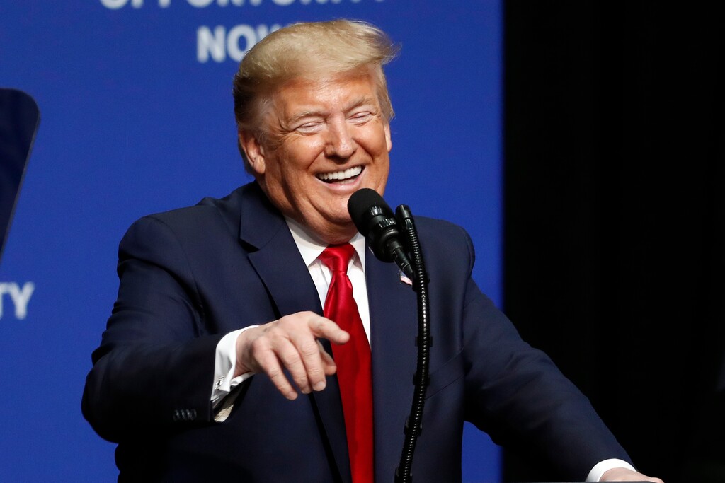 (Gerry Broome | AP) President Donald Trump laughs while delivering comments during the North Carolina Opportunity Now Summit in Charlotte, N.C., Friday, Feb. 7, 2020.