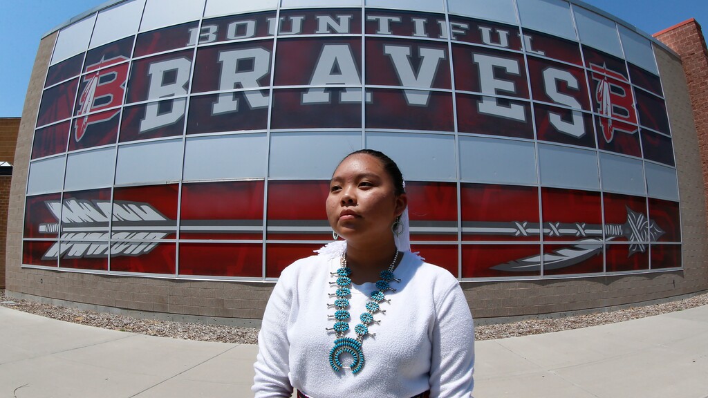 FILE - In this July 21, 2020, file photo, Lemiley Lane, a Bountiful junior who grew up in the Navajo Nation in Arizona, poses for a photograph at Bountiful High School in Bountiful, Utah. A mostly white high school near Salt Lake City will begin the process to replace its hotly-contested Braves mascot after nearly 70 years. Bountiful High School Principal Aaron Hogge said Monday, Nov. 30, 2020, the school will start the process to select a "culturally sensitive mascot that will unite all stakeholders." (AP Photo/Rick Bowmer, File)