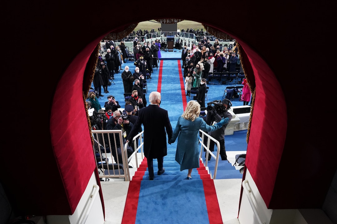 President-elect Joe Biden and his wife Dr. Jill Biden arrive for his inauguration at the Capitol in Washington on Wednesday, Jan. 20, 2021. In his Inaugural Address, President Biden spoke of a return to the ordinary discord of democracy, with a reminder that “politics doesn’t have to be a raging fire, destroying everything in its path.” (Chang W. Lee/The New York Times)