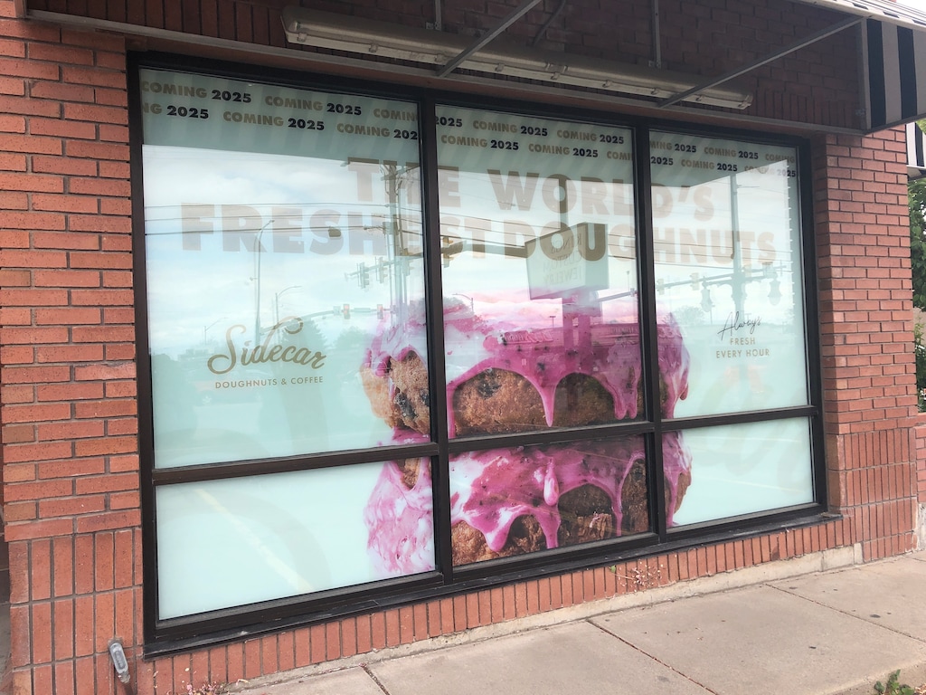 (Kolbie Peterson | The Salt Lake Tribune) A "coming soon" sign is shown in the window of a future location of Sidecar Doughnuts, at 701 E. 2100 South in Salt Lake City.